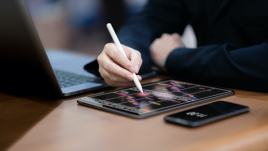 Finance business professional working on tablet
