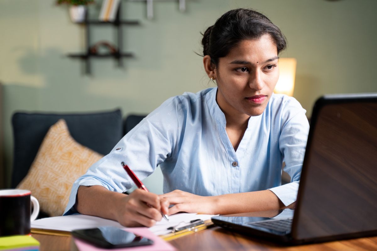 Woman looking at finance business partnering training course on laptop