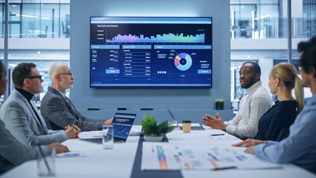 Finance-professional-presenting-meeting-with-a-metrics-on-a-digital-screen
